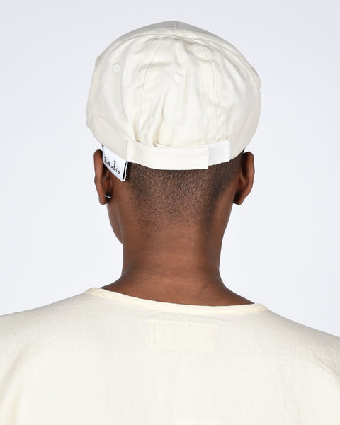 The new order cap in cream