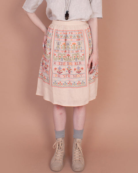 Sampler skirt in sampler embroidery