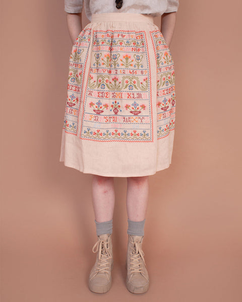 Sampler skirt in sampler embroidery