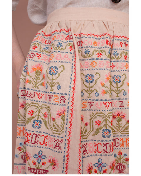 Sampler skirt in sampler embroidery