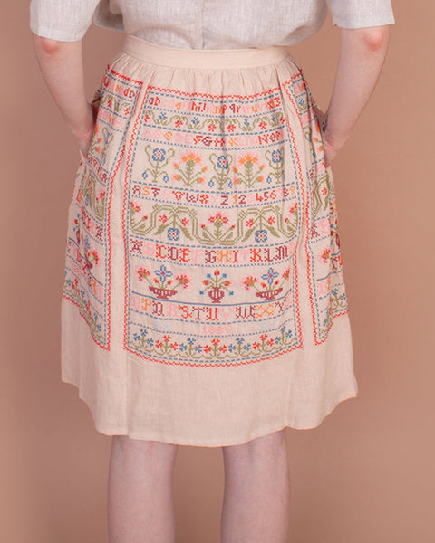 Sampler skirt in sampler embroidery