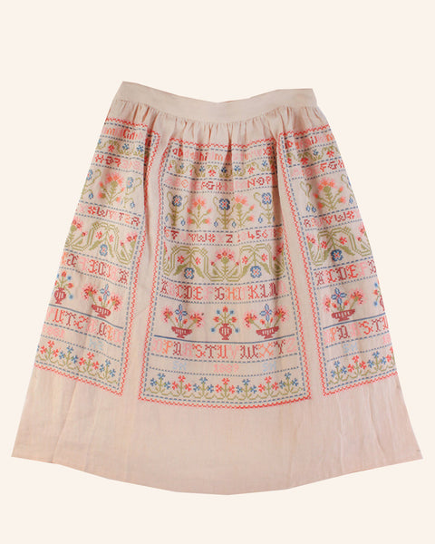Sampler skirt in sampler embroidery