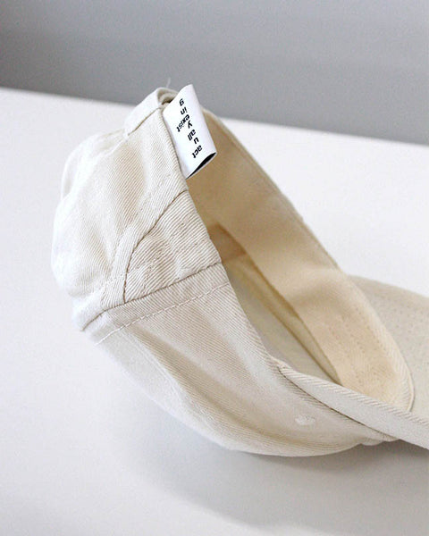 The new order cap in cream