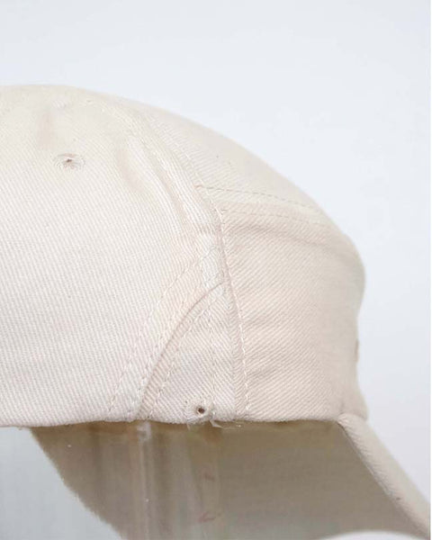 The new order cap in cream