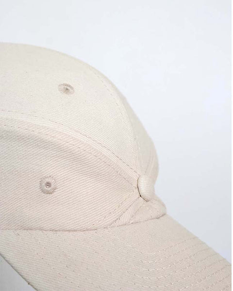 The new order cap in cream